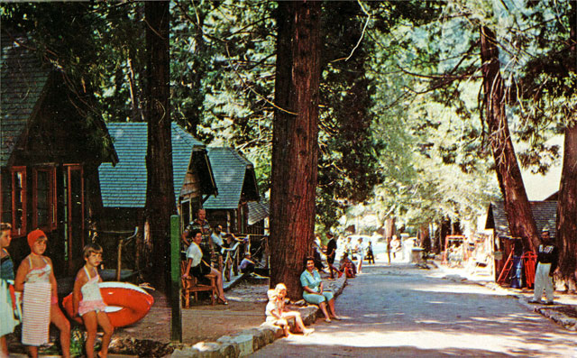 View looking down the main driveway between the cabins (on the left) and the Social Hall, (on the right).